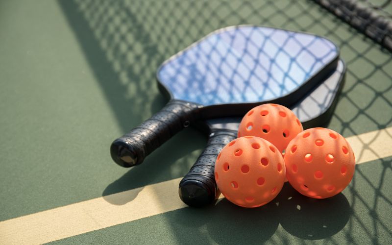 Pickleballs are typically made of durable plastic